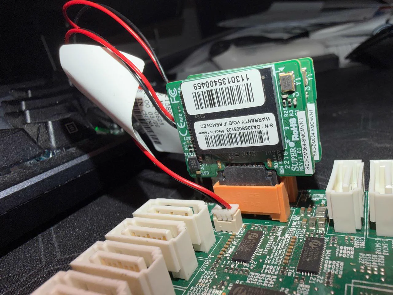 Two Supermicro 64GB SATA DOMs installed on motherboard