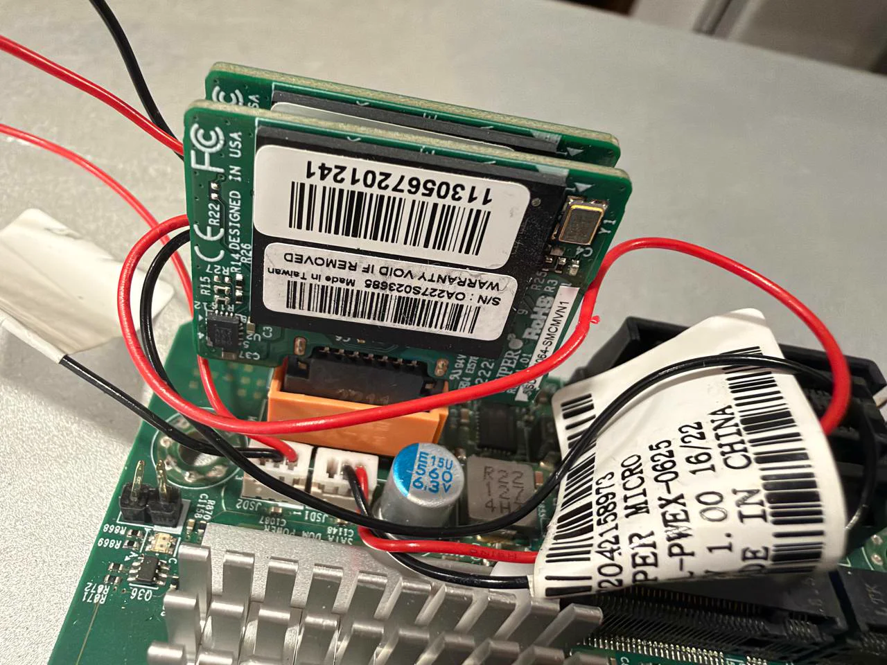 Two 64GB Supermicro SATA DOMs installed on the H12SSL-CT motherboard