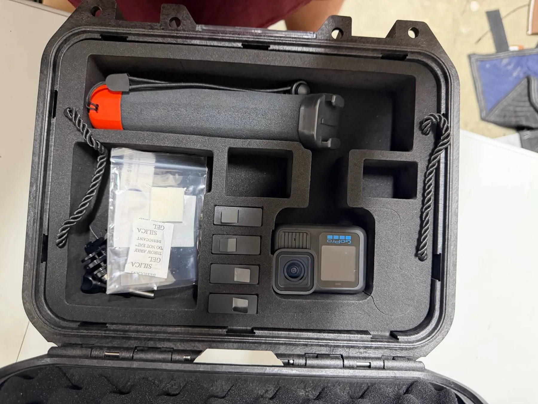 GoPro HERO13 Black and accessories arranged in hard case