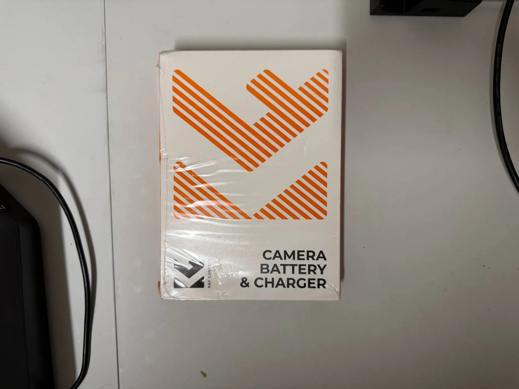 Camera battery and charger accessory box