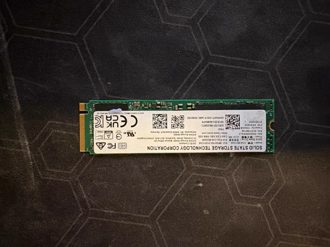 Kioxia CA6-8D1024 1TB NVMe SSD label and circuit board