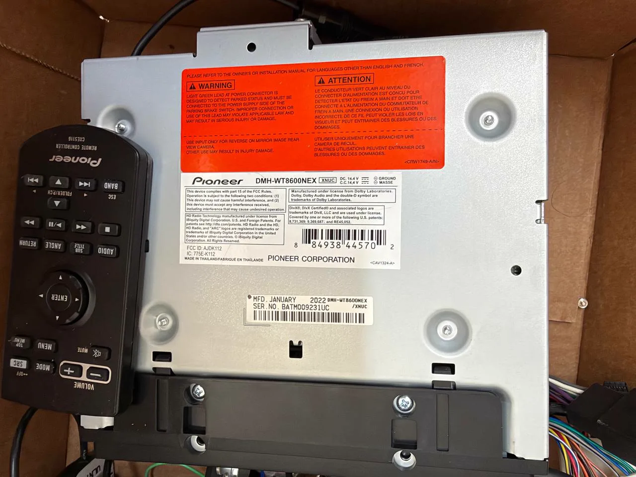 Pioneer DMH-WT8600NEX model label and included remote control