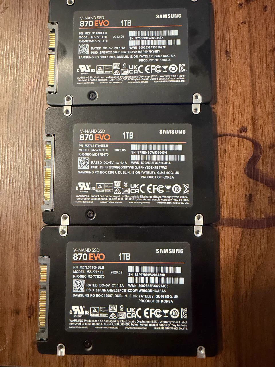 Labels and serial numbers for three Samsung 870 EVO 1TB SSDs