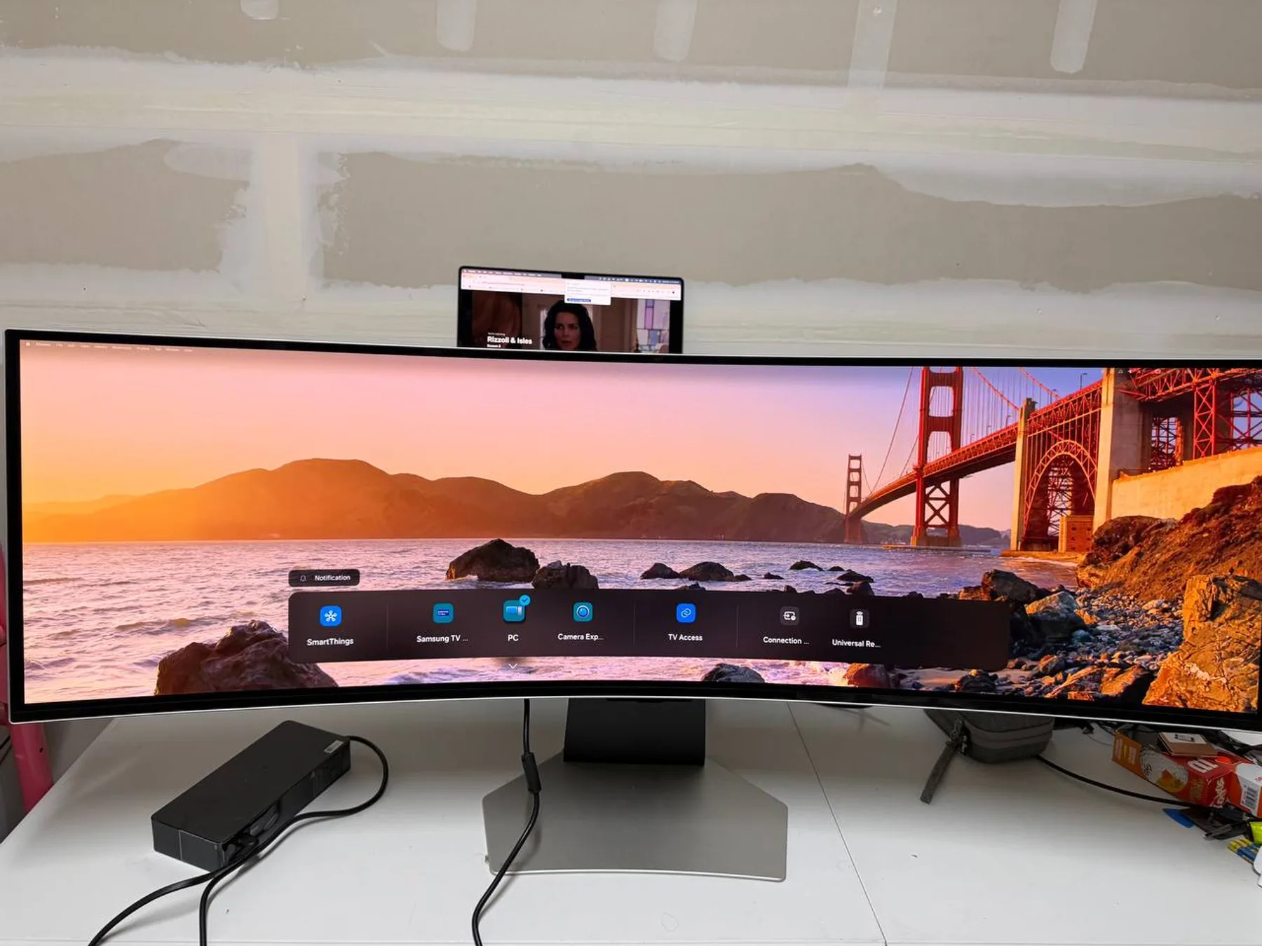 Samsung Odyssey OLED G9 powered on with original stand